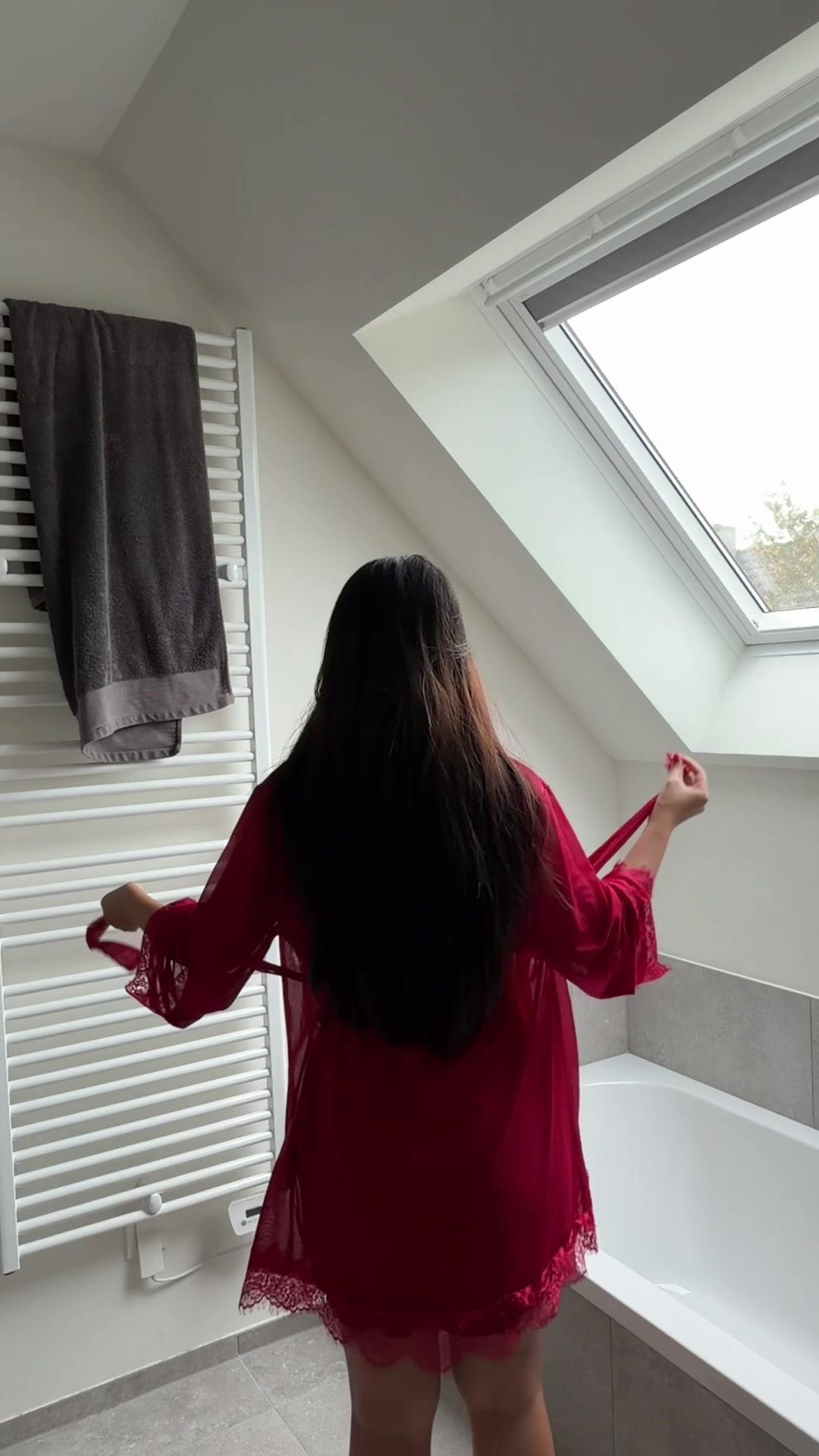 Woman Changing Out of Robe into Sweater