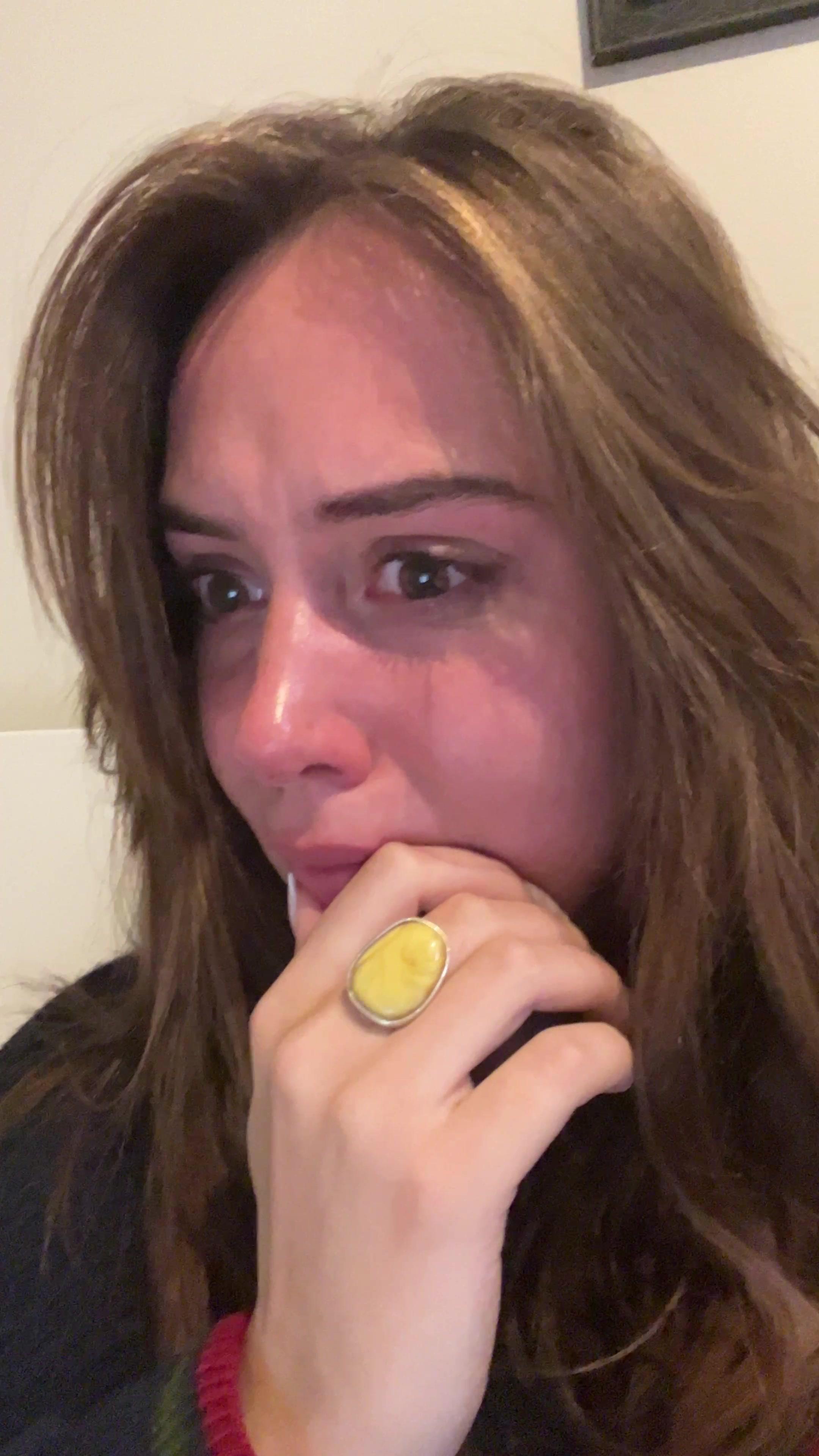 Young Woman Crying and Covering Her Mouth