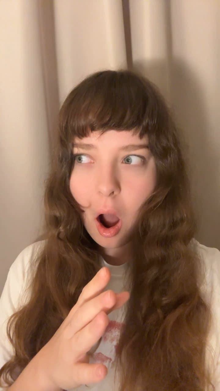 Woman Reacts with Amazement and Surprise